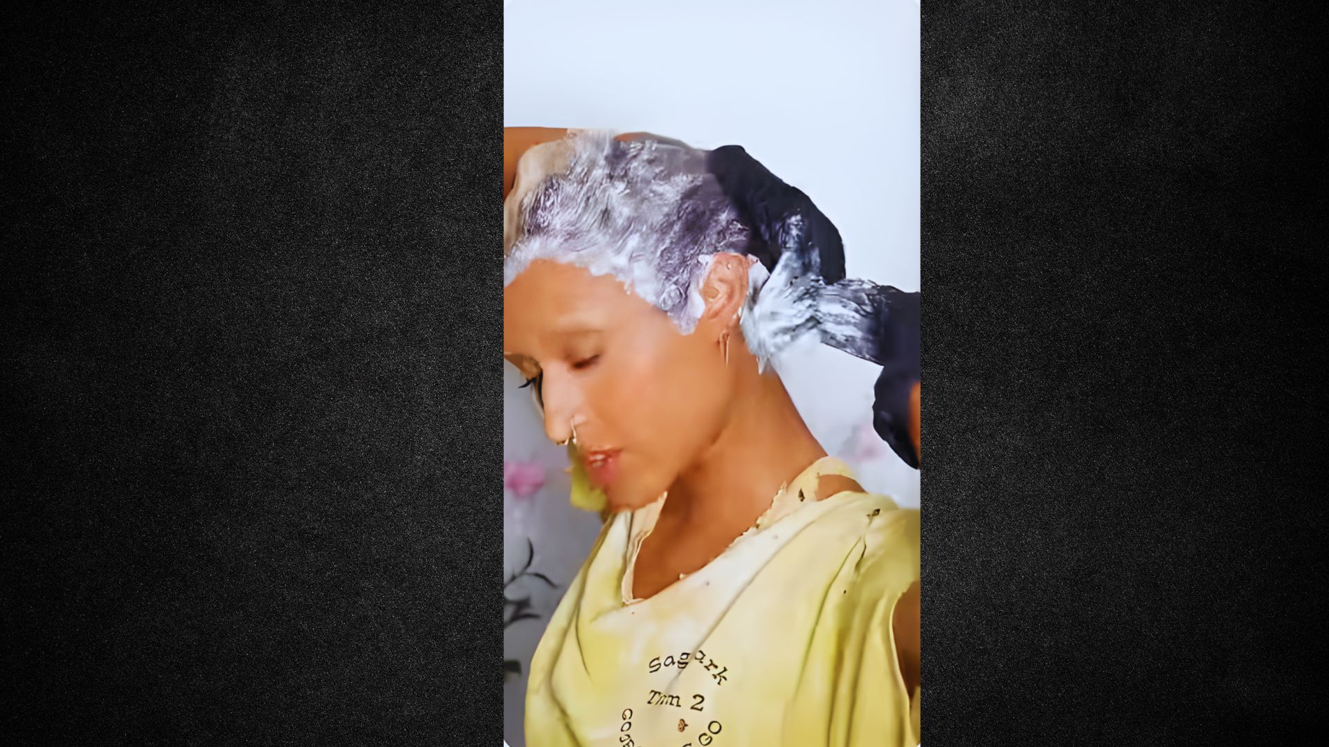 A woman with her hair wrapped in a plastic bag, showcasing a unique hairstyle or hair treatment method.