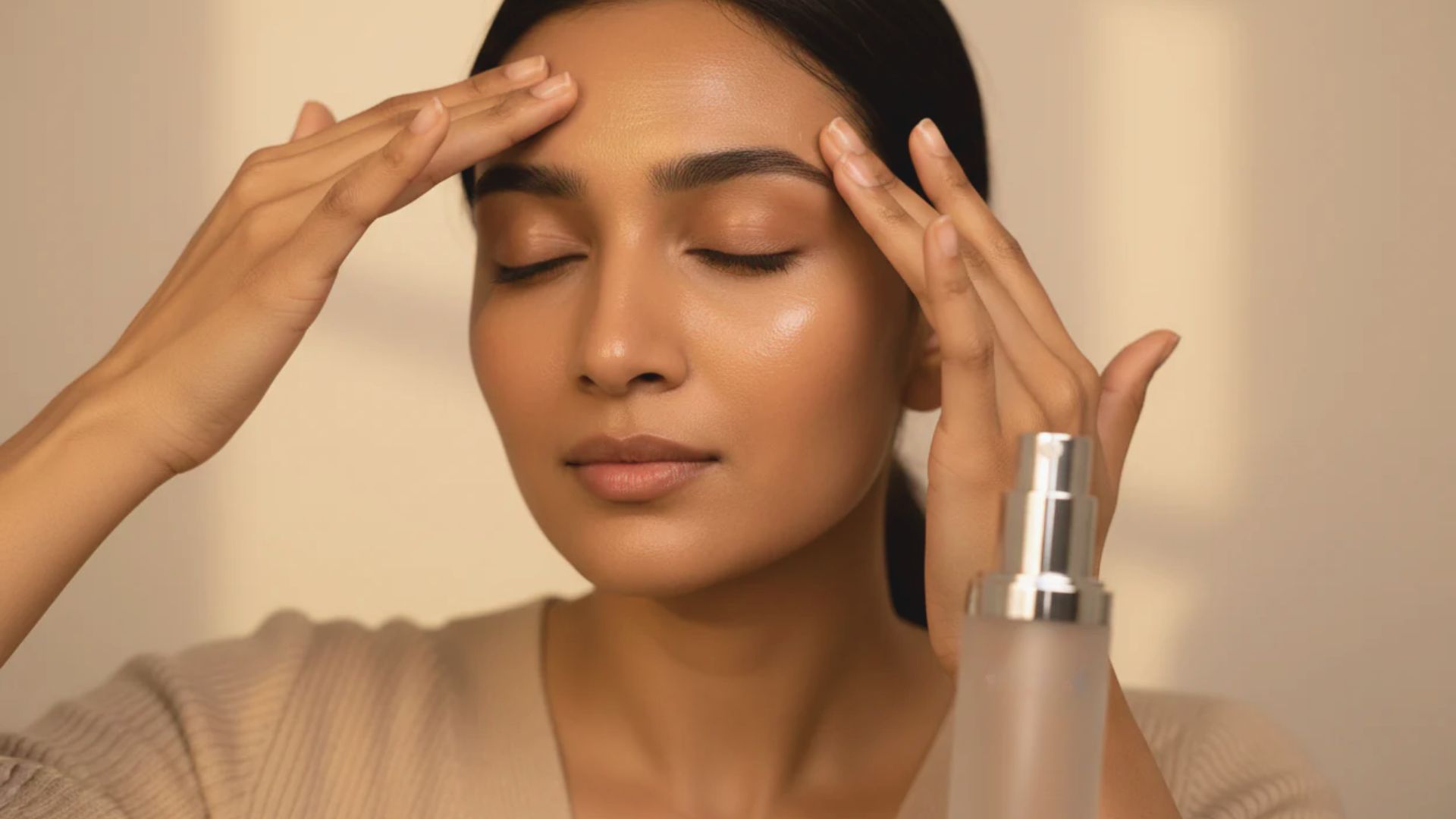 A woman is holding her head and rubbing her eyes, appearing stressed or fatigued.