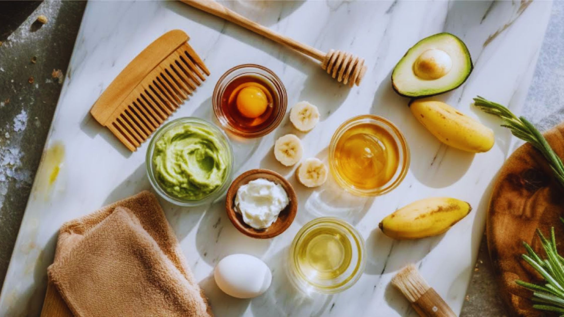 A cutting board displays various hair care ingredients, including oils, herbs, and natural products for DIY treatments.