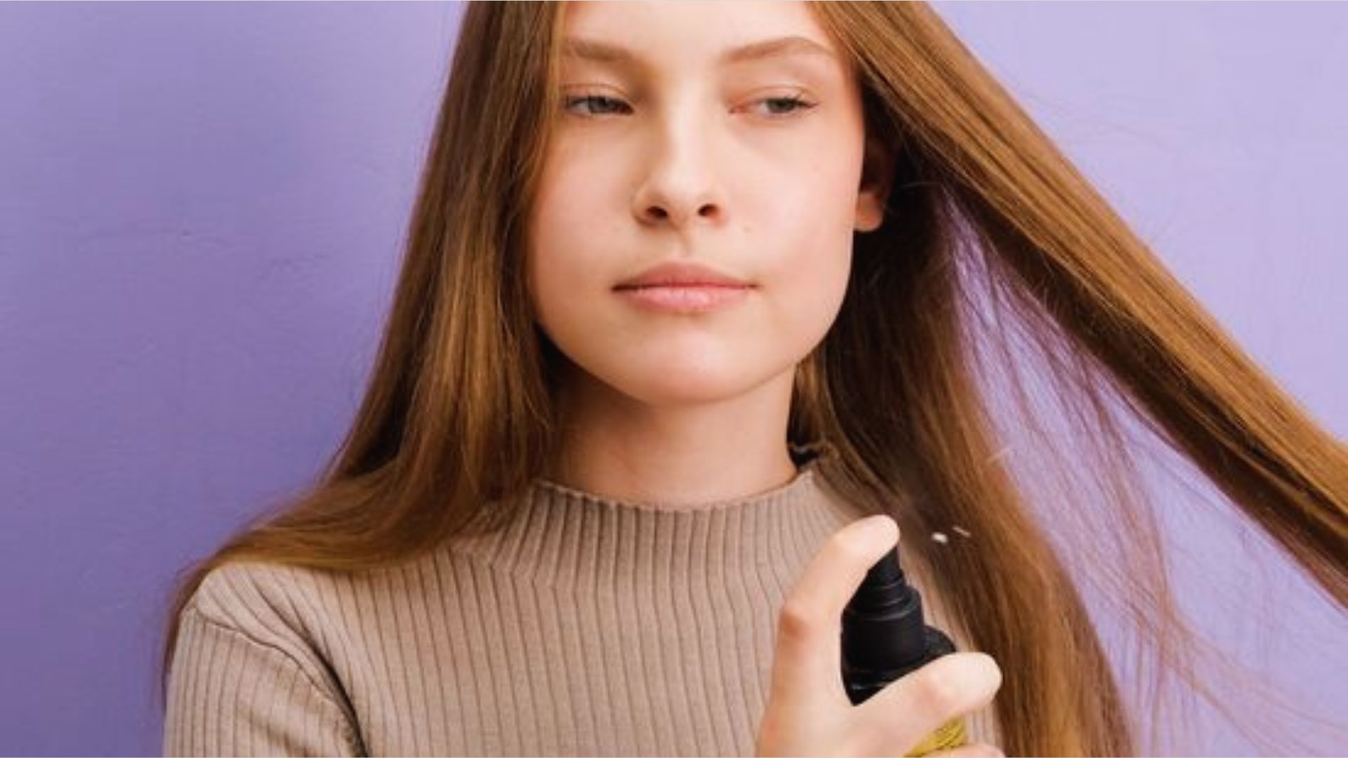 A woman applies hair spray to her damp hair, preparing to style it as it dries.