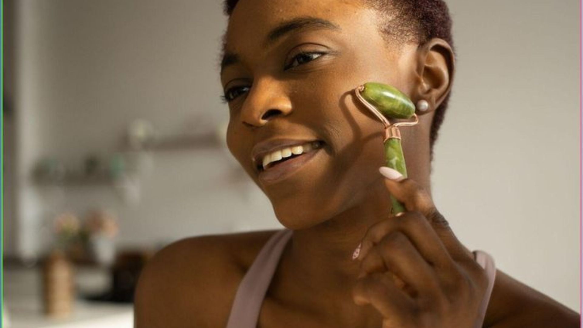 A smiling woman holds a vibrant green leaf, showcasing her connection to nature and joy.
