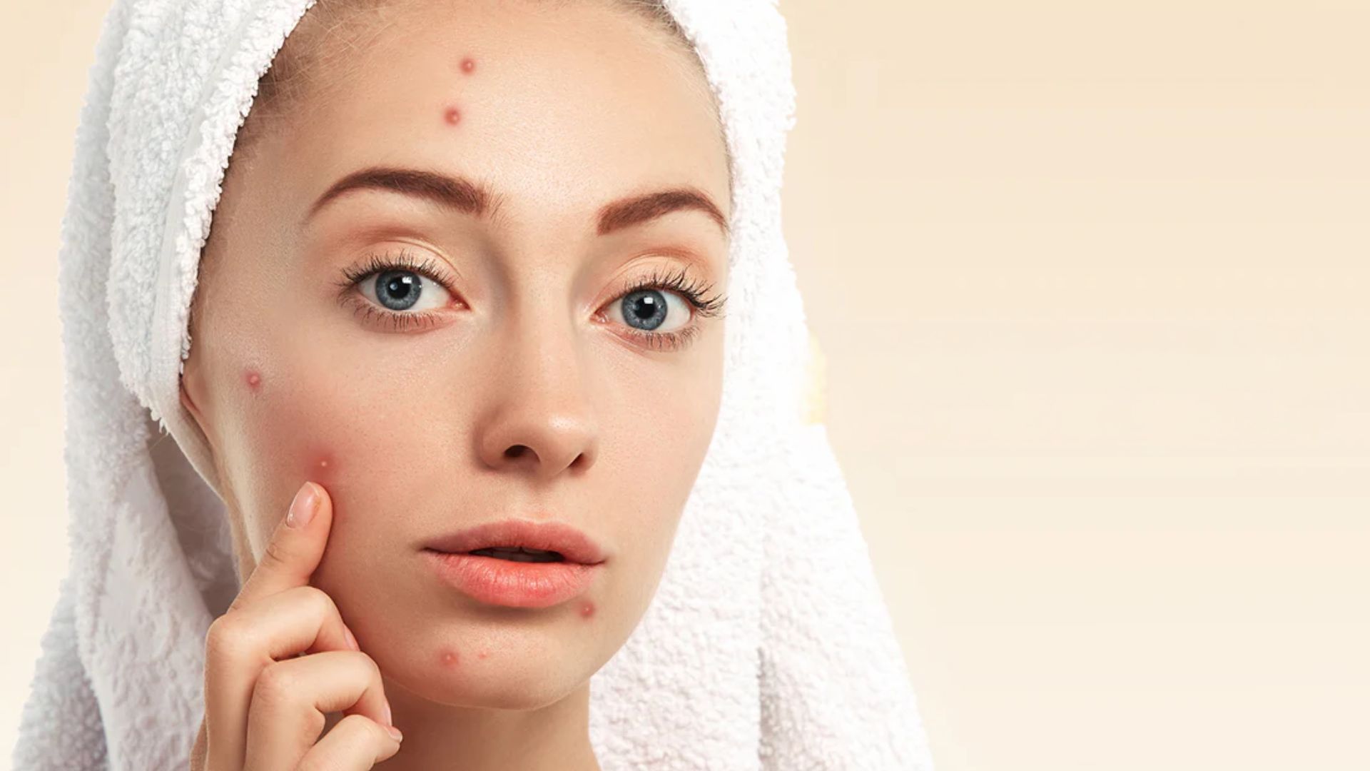 A woman , examining her face with a thoughtful expression, reflecting on her skin's condition.