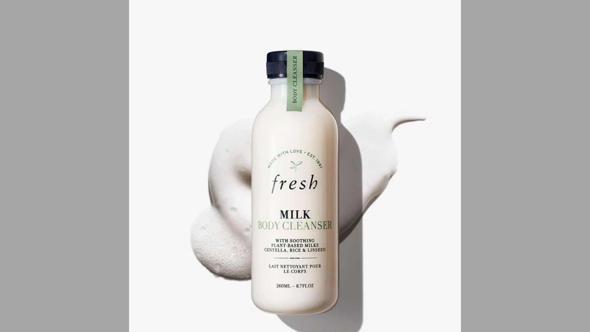 A bottle of milk placed on a wooden table, with soft lighting highlighting its smooth surface.