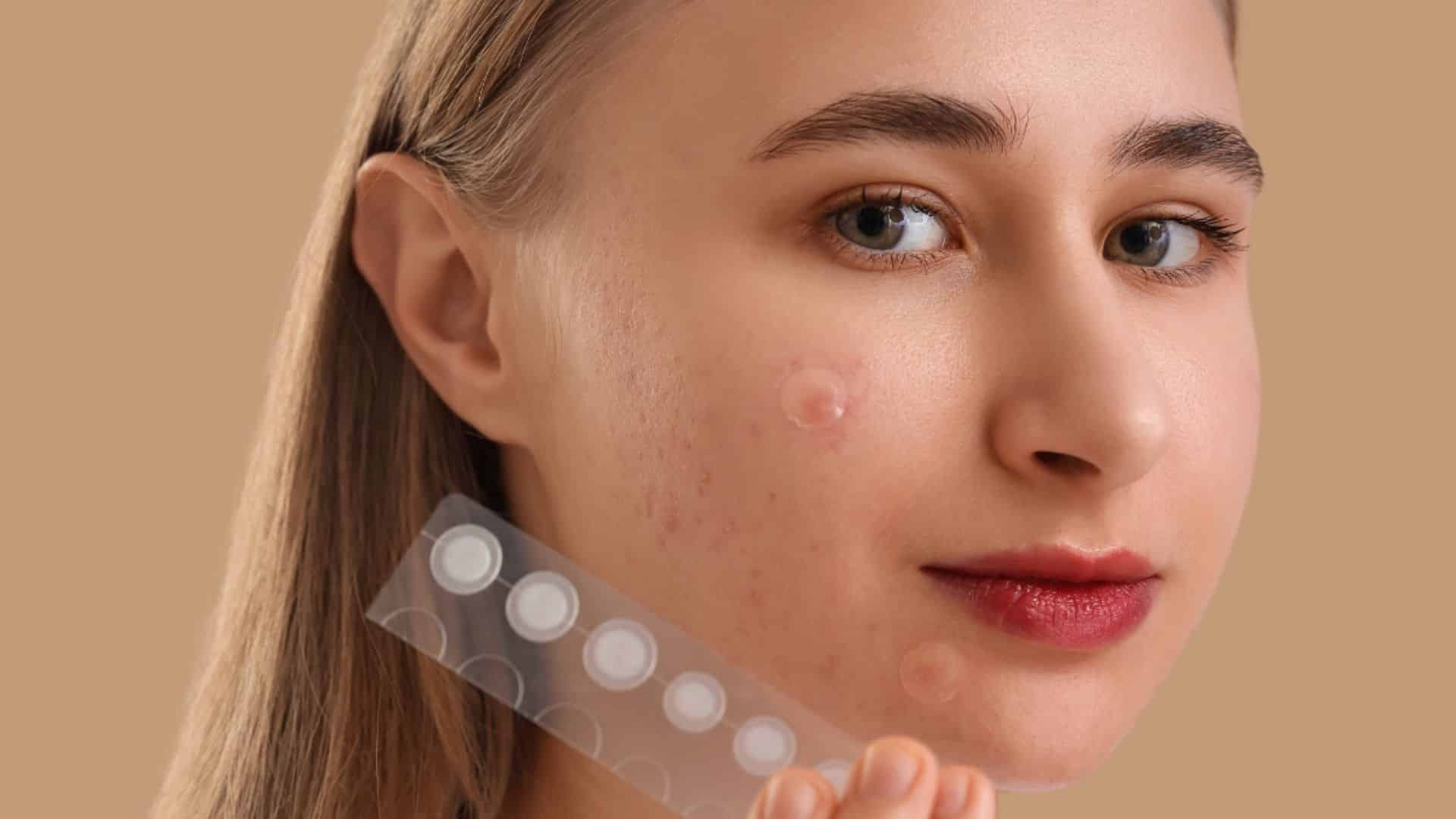 A woman holds a plastic sheet featuring a prominent white spot in the center.