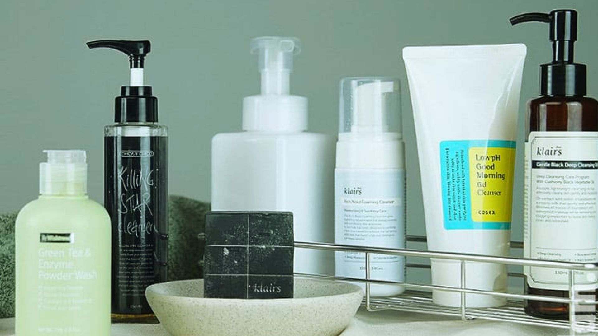A basket filled with various beauty products, including lotions, makeup, and skincare items, arranged attractively.