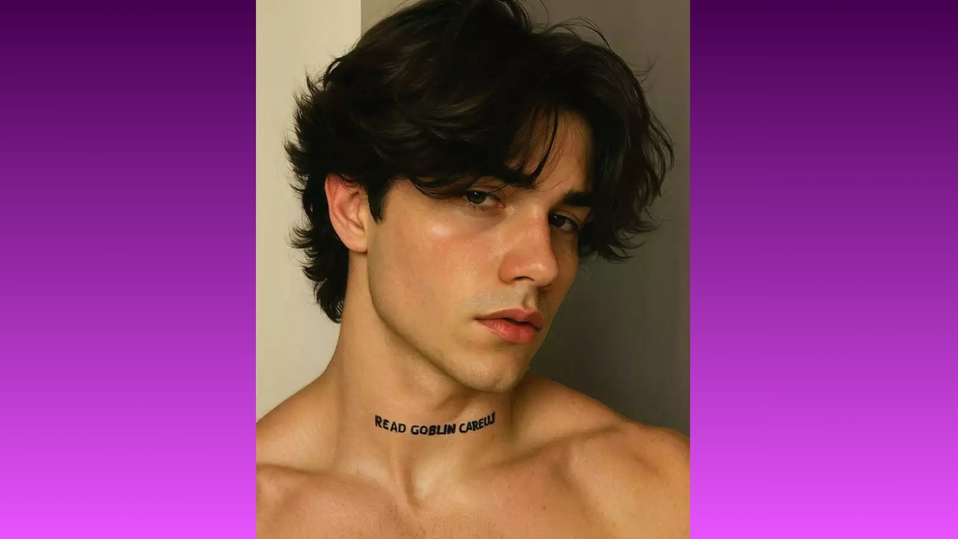 Young man with wavy dark hair gazes seriously at the camera. He has "READ GOBLIN CAREFULLY" text on his neck. Background is a purple gradient.