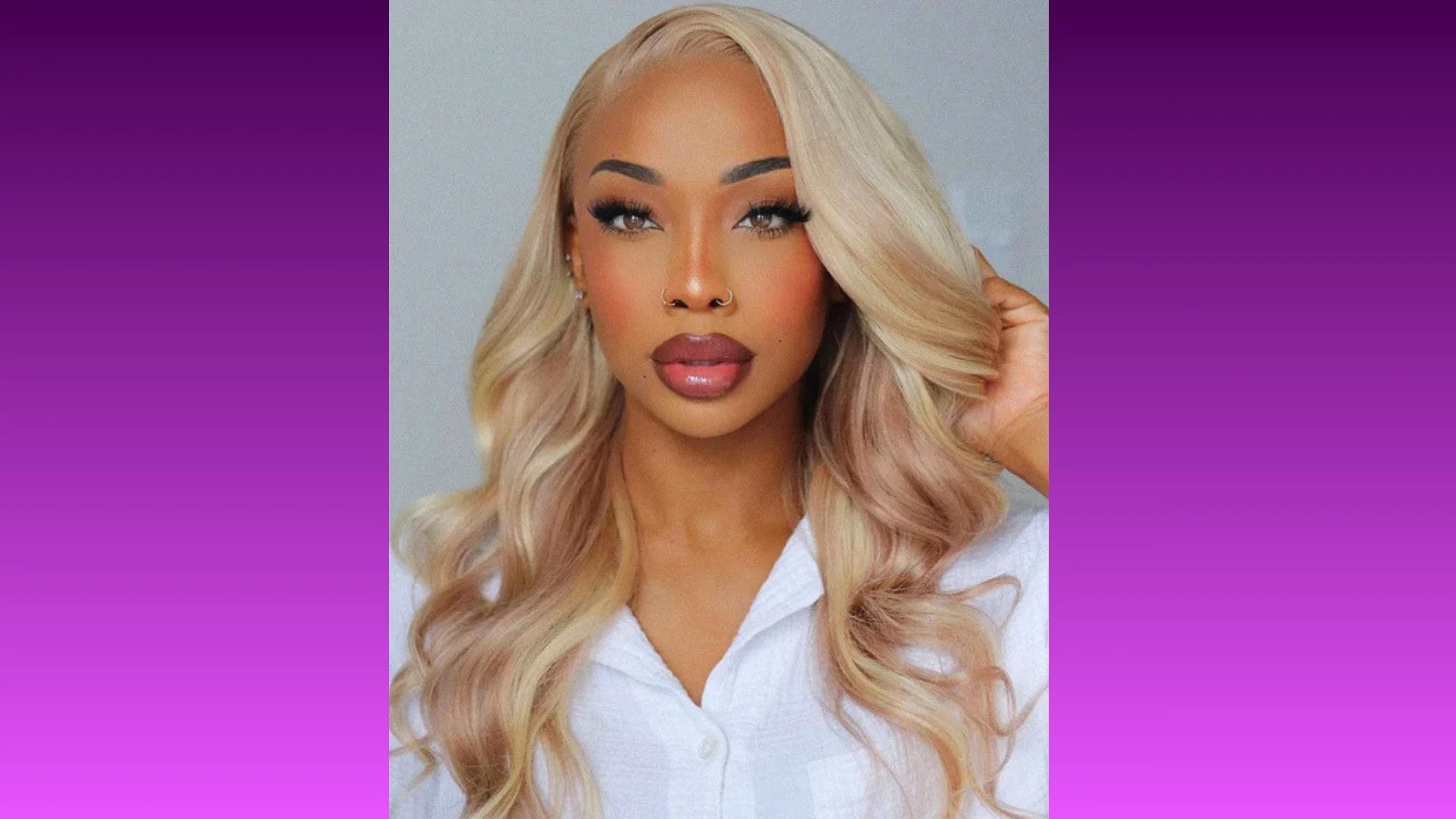 A woman with long, wavy blonde hair poses confidently against a gradient purple background. She wears a white top, with a serene and poised expression.