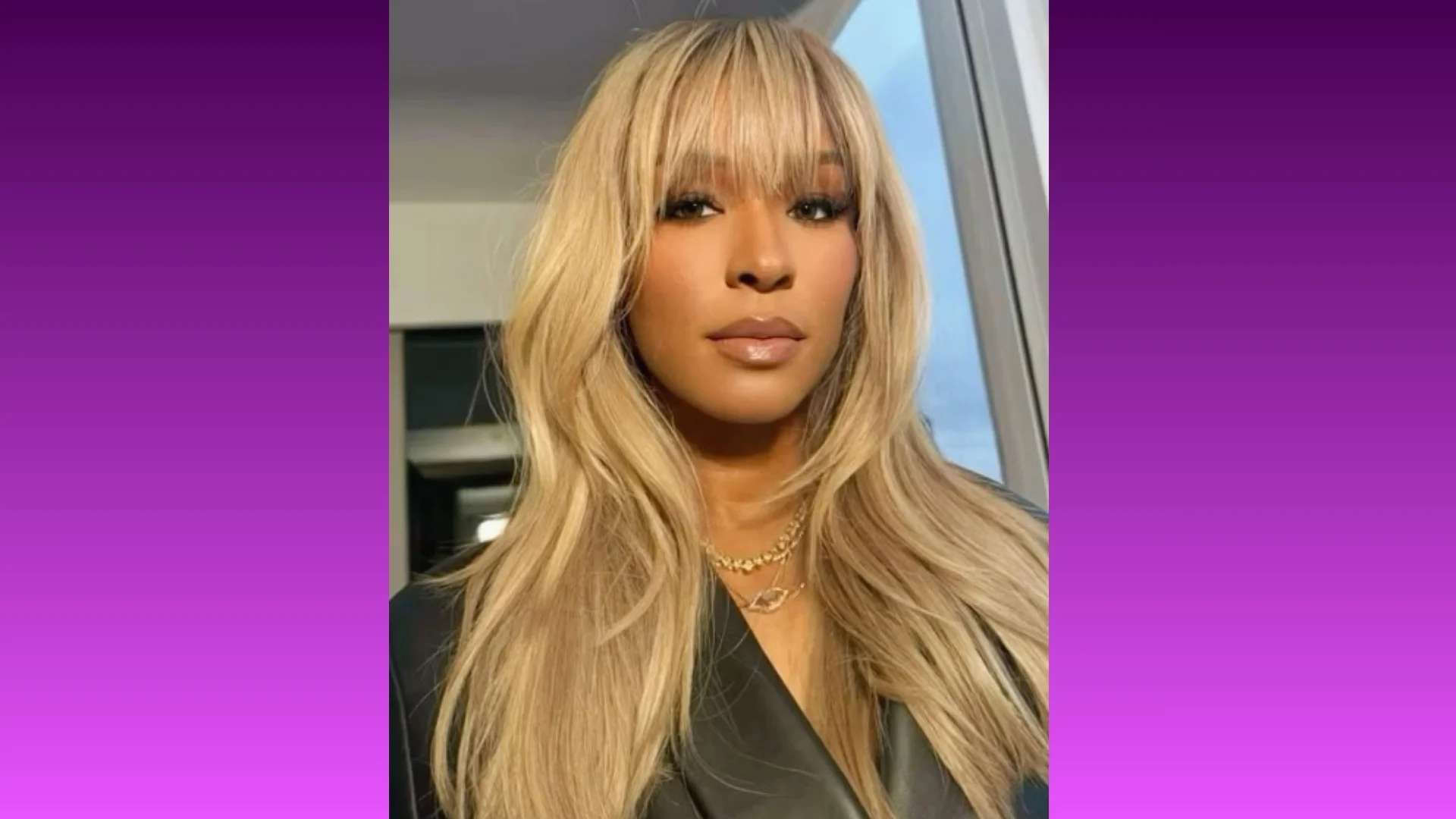 A person with long, straight blonde hair and bangs poses confidently. They wear a dark outfit and gold necklace, set against a gradient purple background.