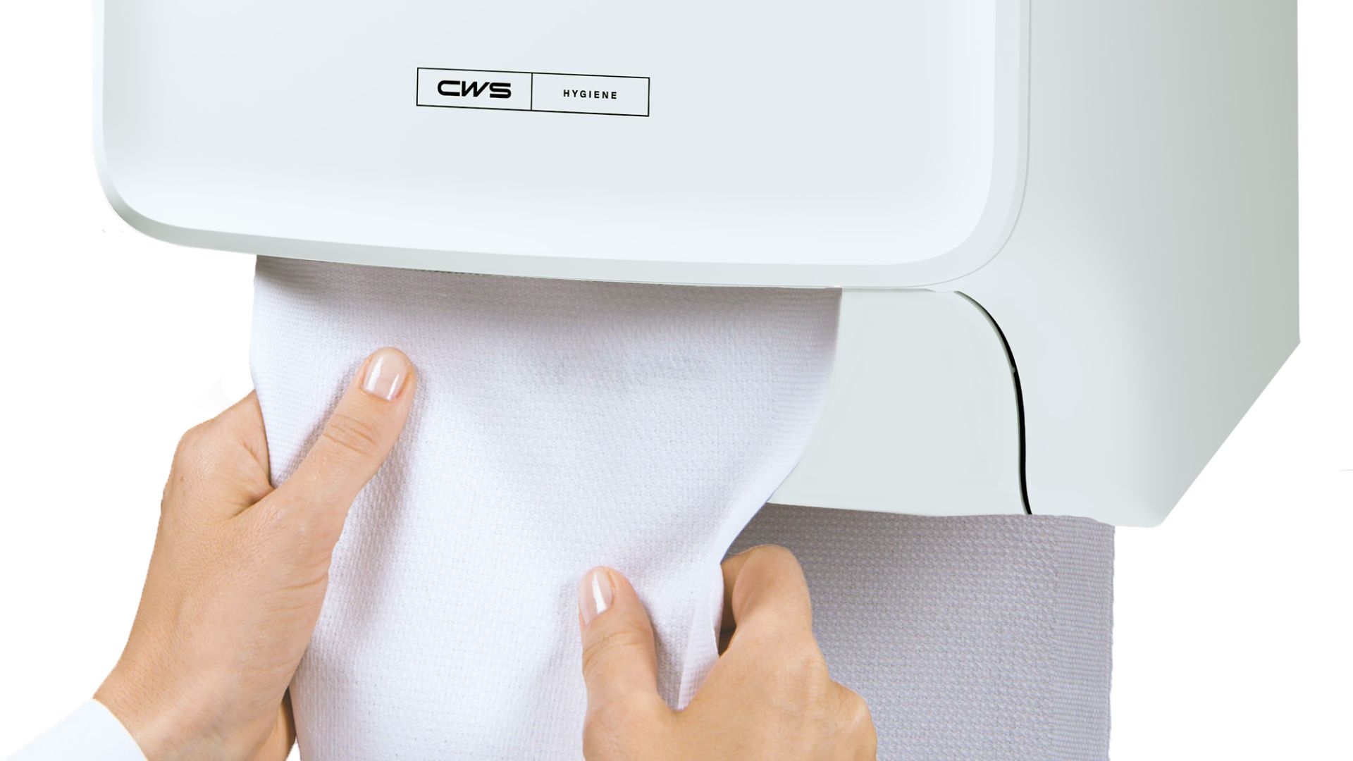Hands pull a white towel from an automatic dispenser, labeled "CWS Hygiene," against a white background. The scene suggests cleanliness and efficiency.
