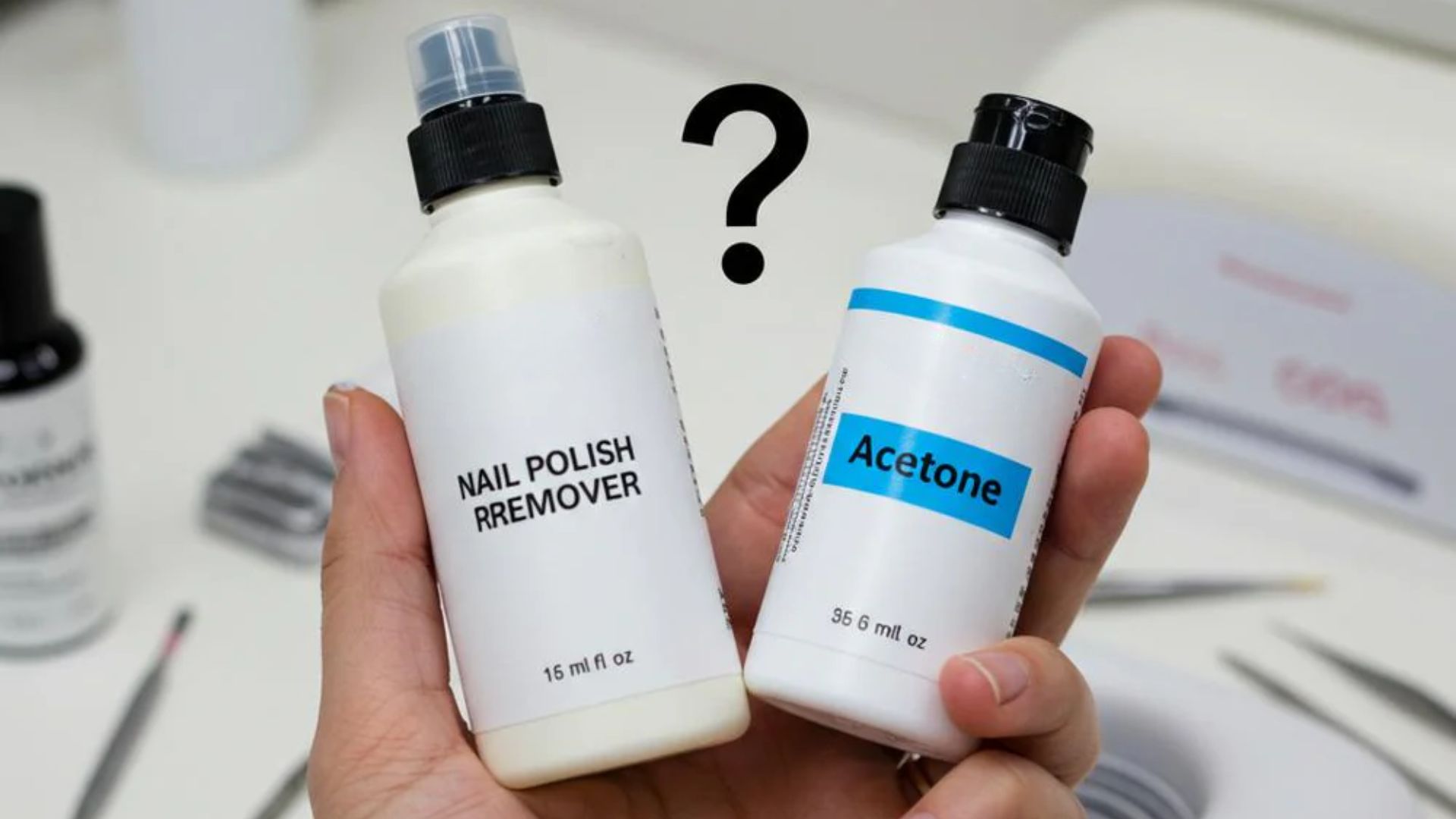 Two hands hold bottles labeled "Nail Polish Remover" and "Acetone" against a blurred background, with a large question mark in between, conveying confusion.