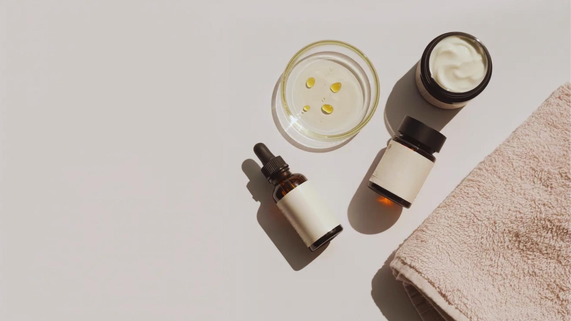 Rose oil with skincare necessities arranged neatly showing how to include it in a simple daily routine without direct face application.