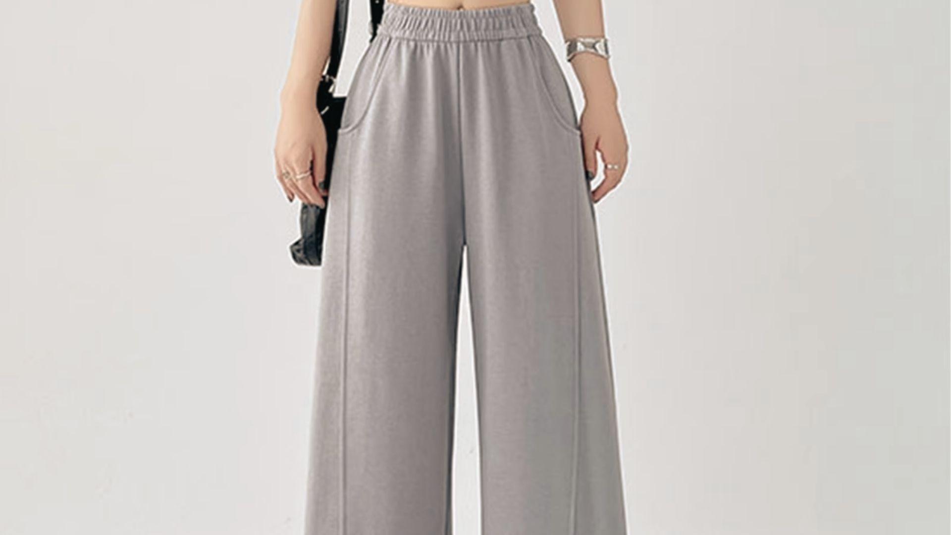 Model wearing high-waist grey wide-leg sweatpants, comfy and dark to wear.