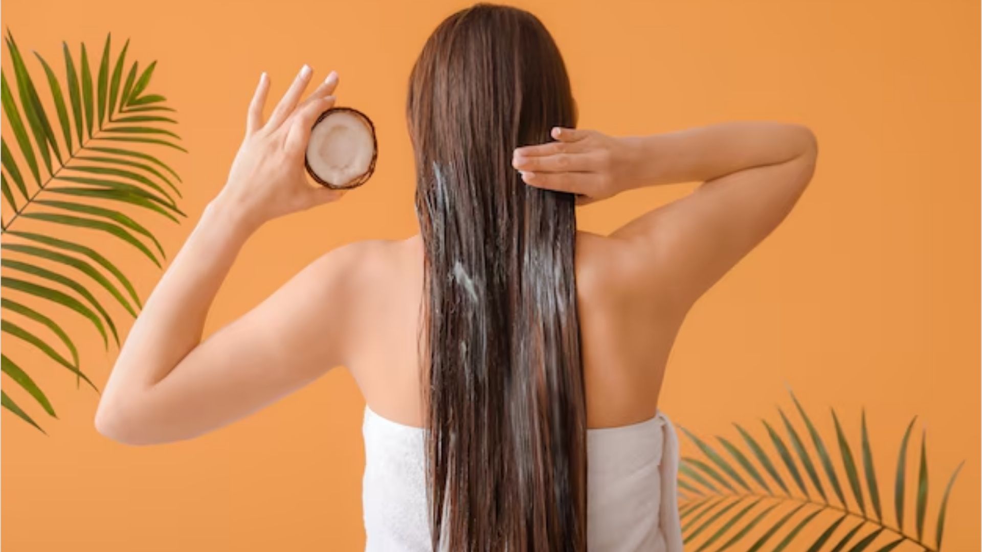 Coconut oil applied to hair to reduce breakage and improve strength