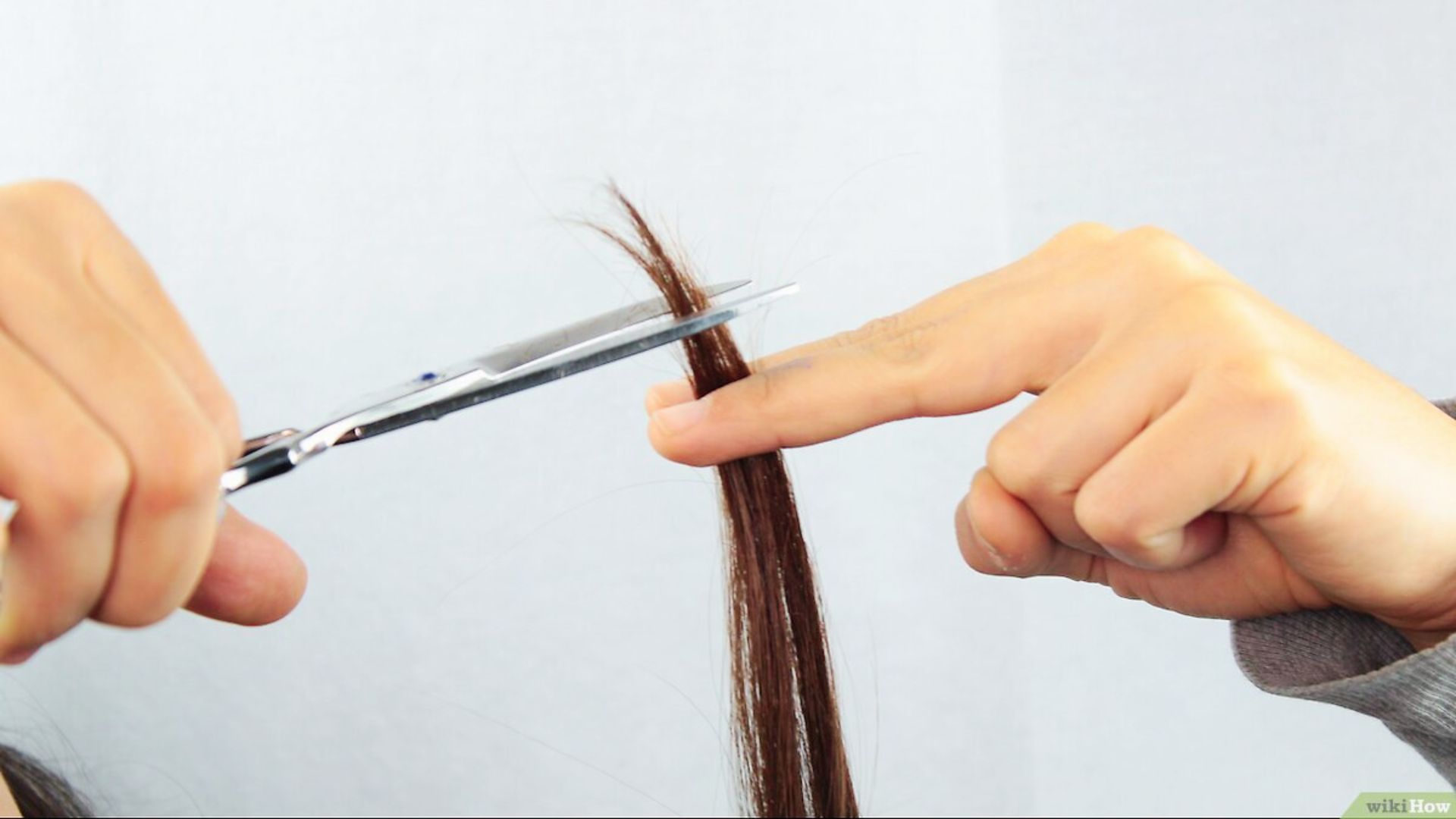 Regular trimming of split ends to reduce breakage and retain hair length.