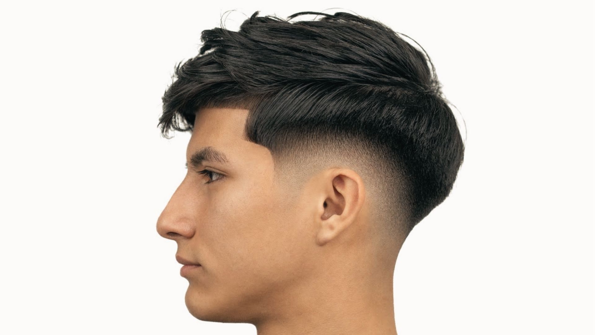 side view of low fade blending into neckline with textured top and sharp hairline for contrast.