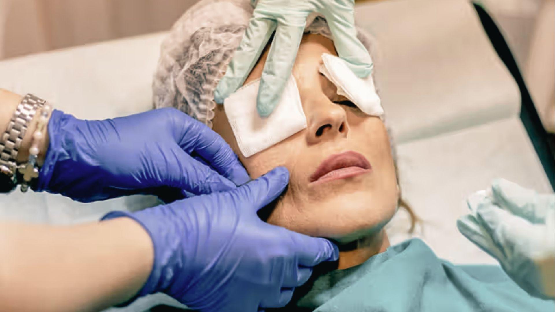 Professional administers under eye treatment to minimize wrinkles with precision injection