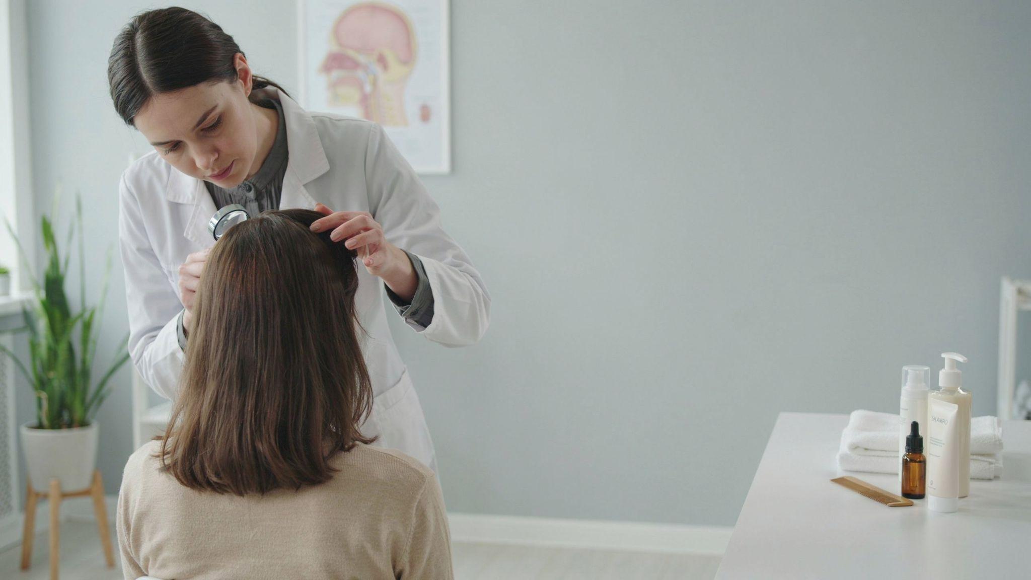 Healthy scalp examination with hair care treatments for dandruff management and prevention