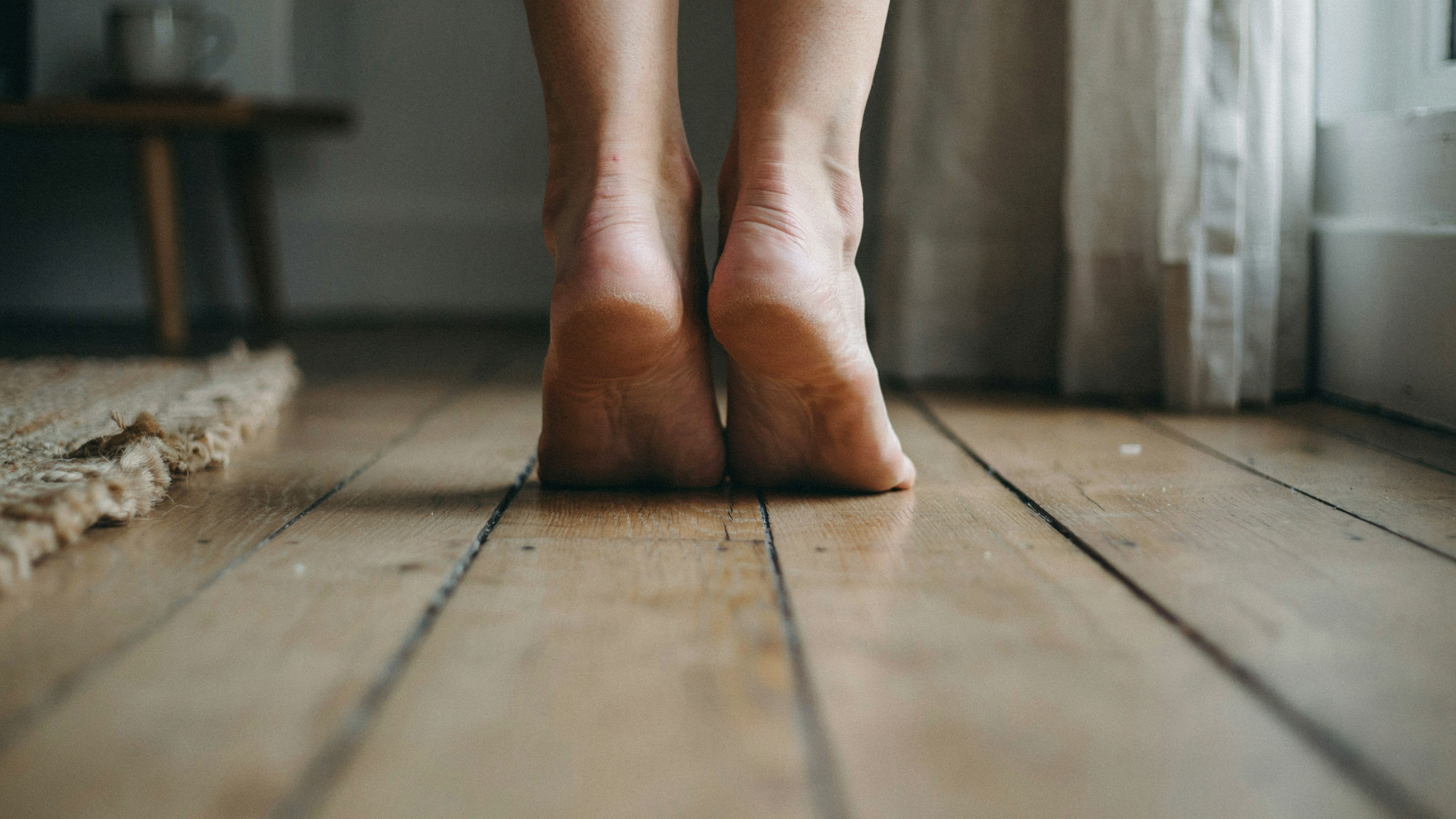Bare feet showing mild dryness on the heels and soles.
