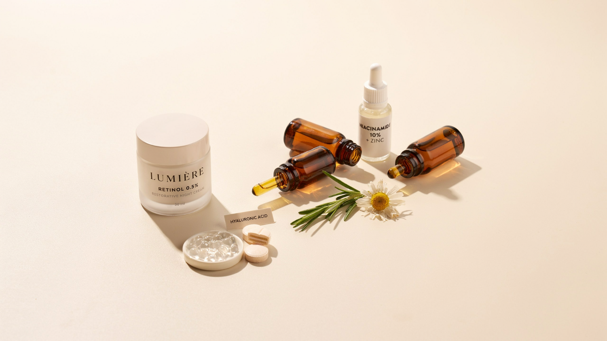 Retinol skincare setup with cream and ingredients like niacinamide hyaluronic acid and ceramides on a clean minimal background.