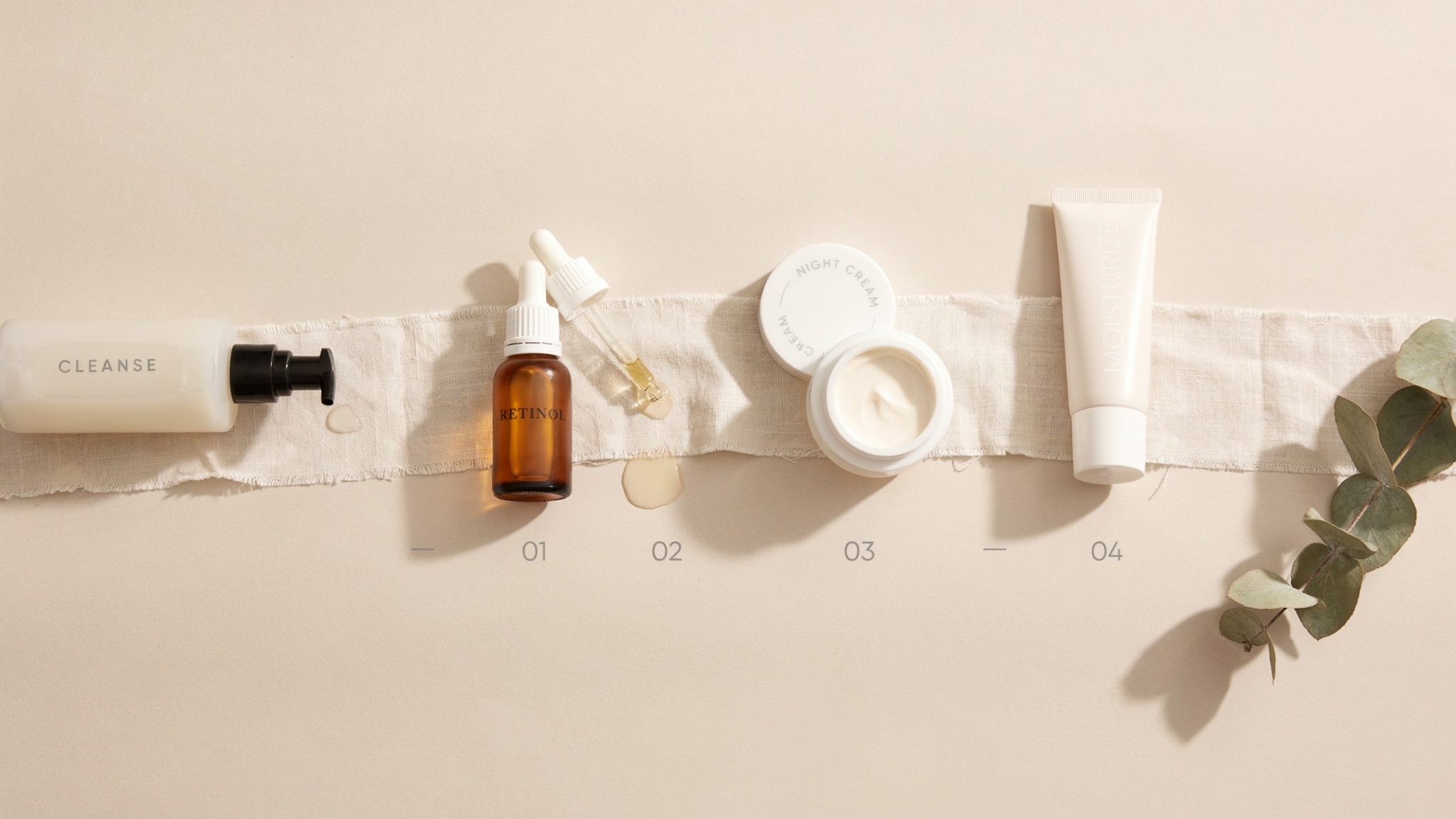 Skincare products arranged in correct order including cleanser retinol and moisturizer on a clean minimal background.
