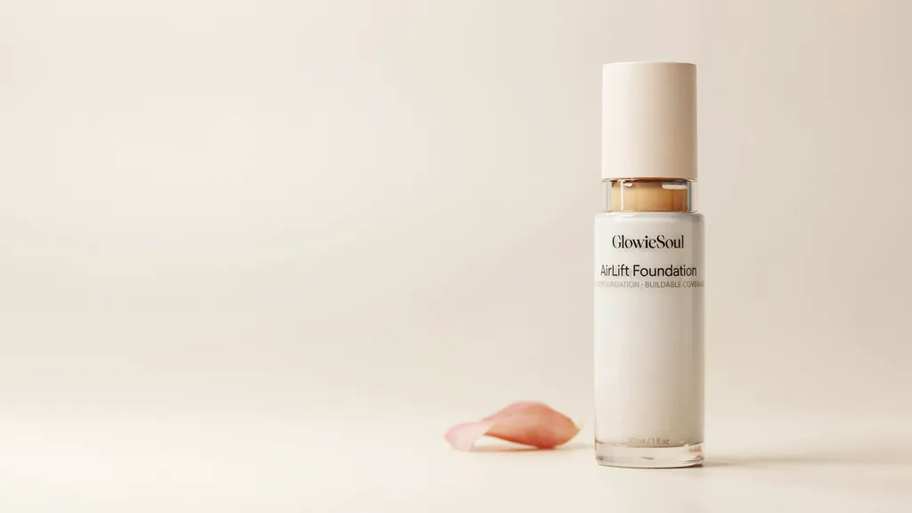 GlowieSoul AirLift Foundation bottle with buildable coverage displayed upright on a cream background.
