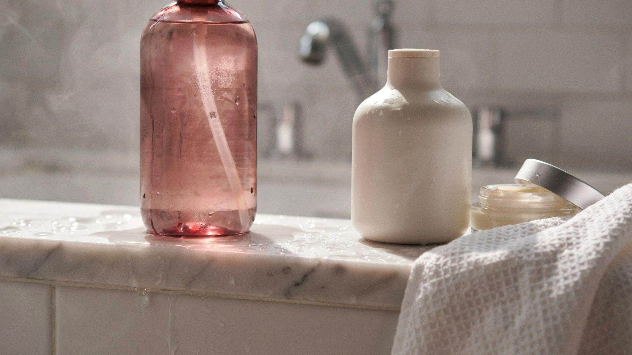Bathroom shelf with contrasting lighting showing shampoo caution and body wash as safer daily options.