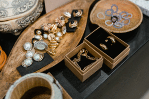A table displaying an assortment of jewelry and accessories, including necklaces, bracelets, and earrings.
