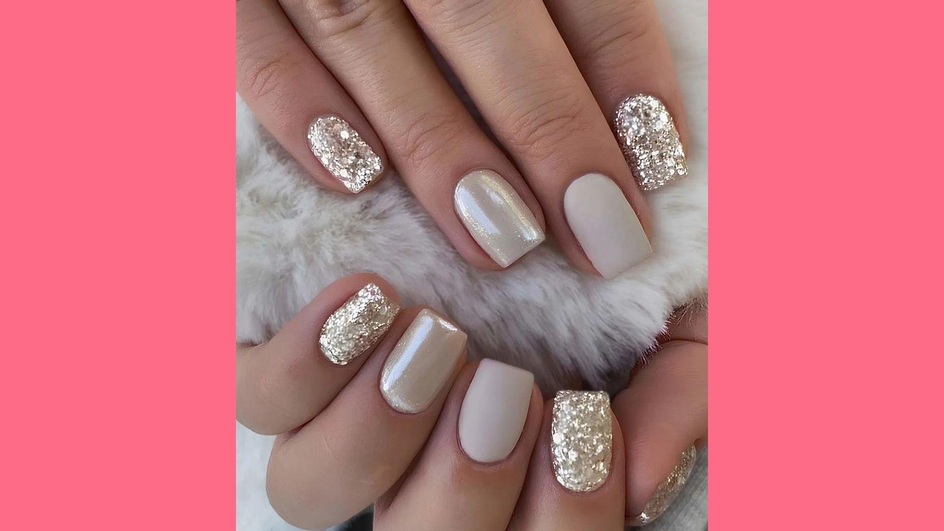 Mixed manicure with matte nude, glossy pearl, and chunky gold glitter nails on white fur