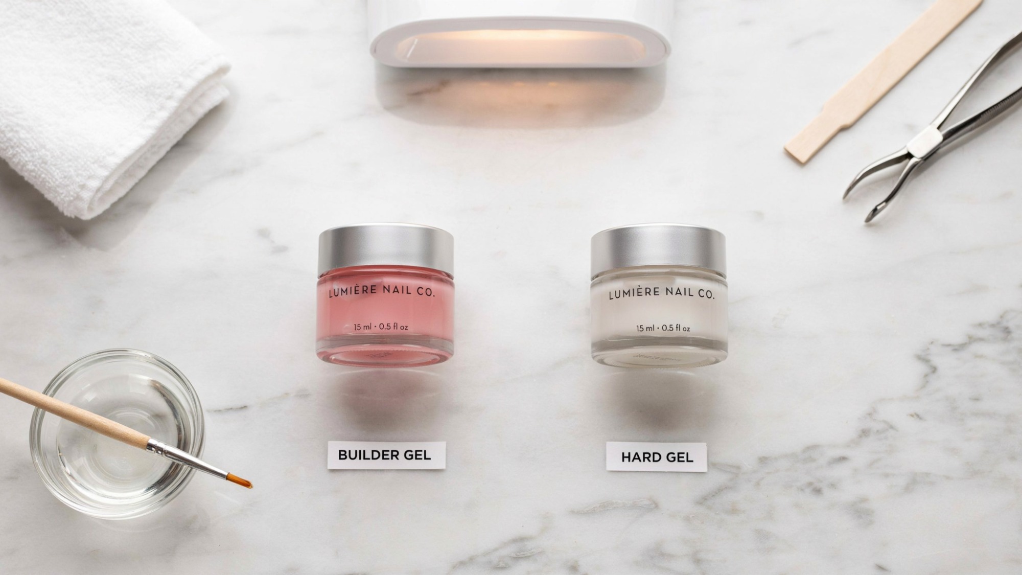 Builder gel and hard gel products displayed side by side in a nail salon setup.