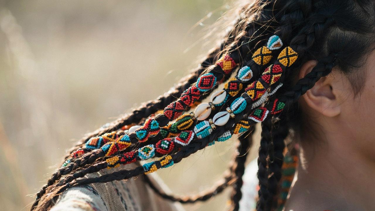 Traditional braided hairstyle decorated with handcrafted beads.