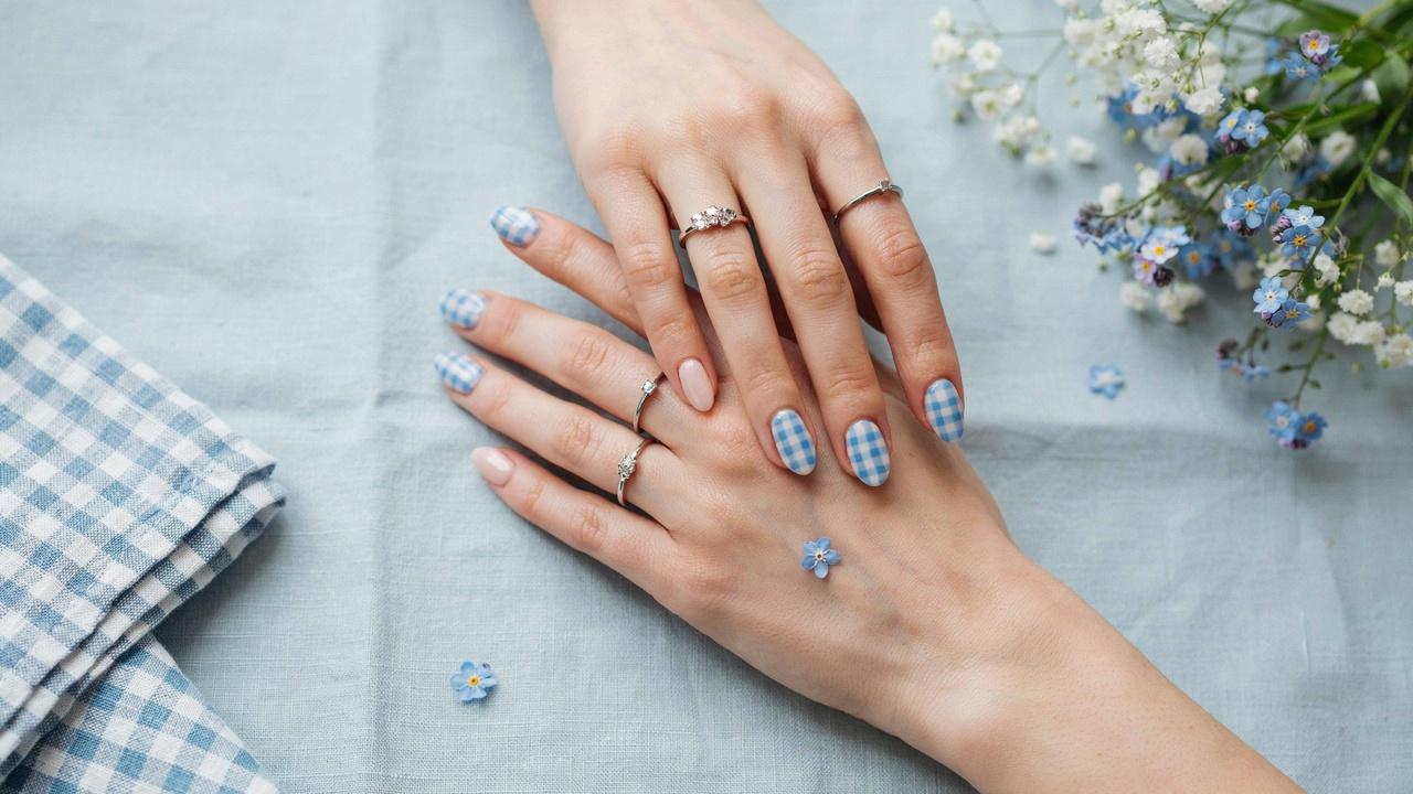 classy blue and white gingham nails featuring a glossy checkered pattern with a soft cottagecore aesthetic.