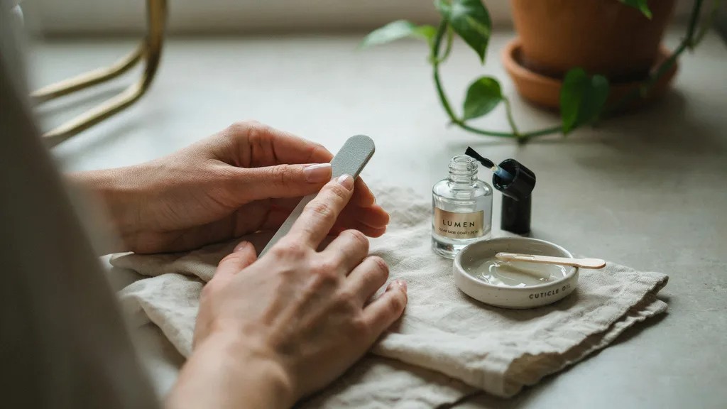 Healthy nails maintained with proper filing and nail care.