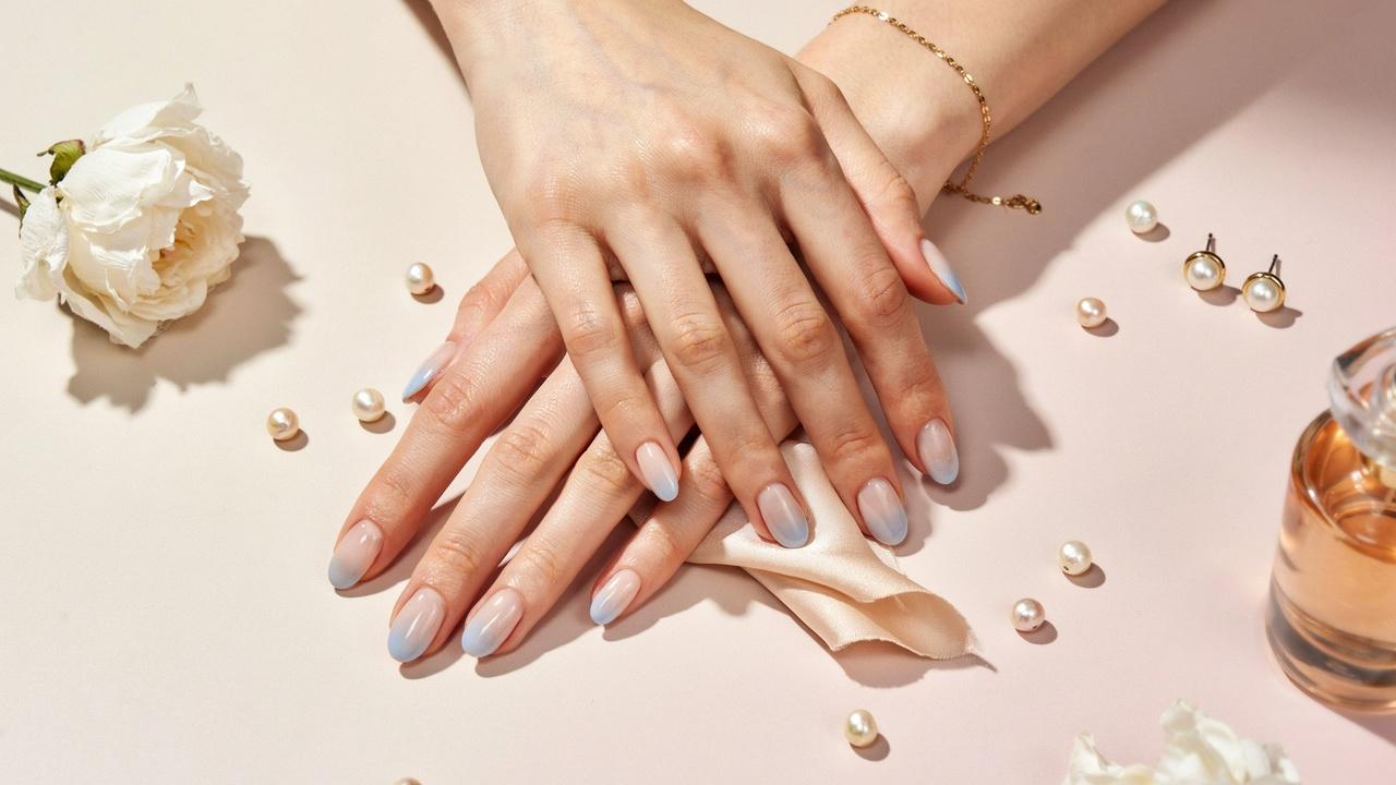 classy blue and white ombre nails with a smooth gradient effect and glossy finish.