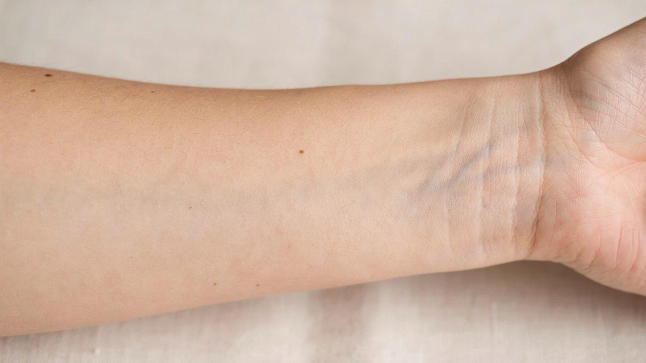 Close-up of skin naturally fading after a tan.