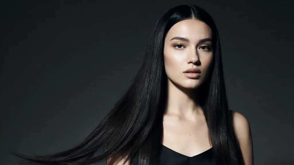 Raven black hair with deep glossy shine and smooth texture.
