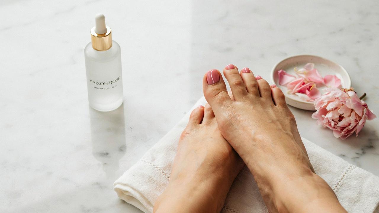 realistic blush pink pedicure with rosy glossy finish in refined style