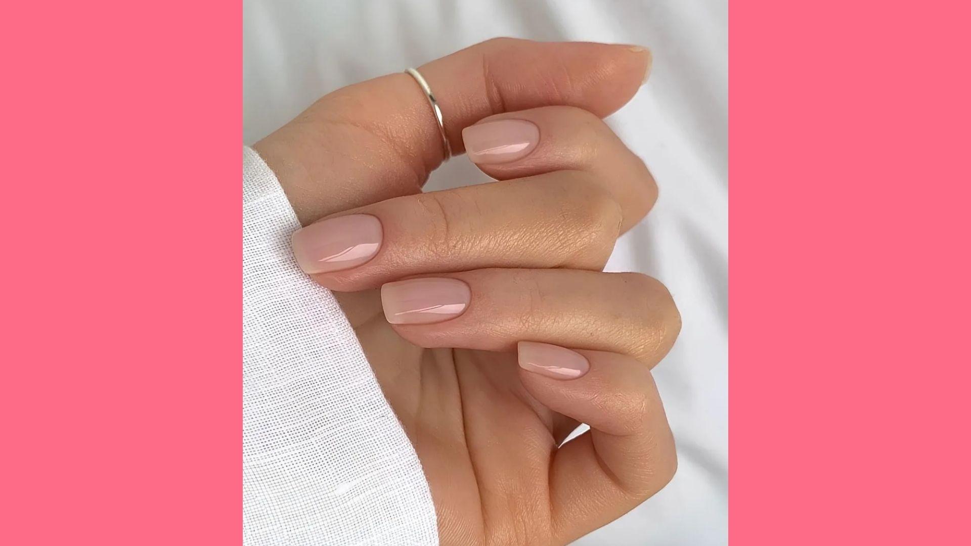 Short square sheer nude glossy nails, thin silver midi ring, white textured sleeve, soft fabric