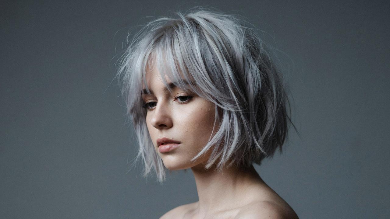 Silver shaggy bob with textured layers.