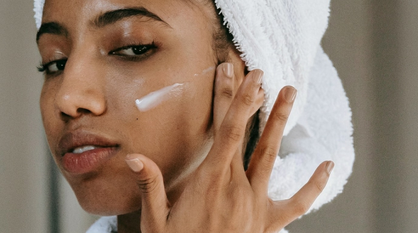 Person applying benzoyl peroxide to the face while following gentle skincare.